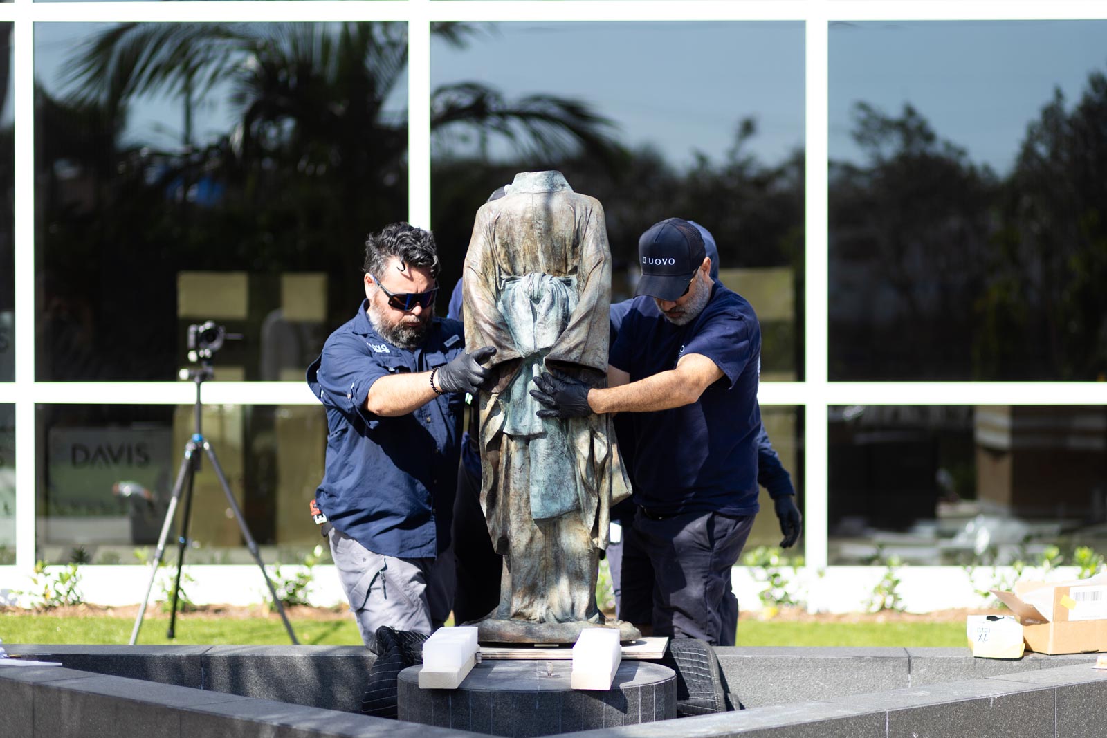 installing cast bronze sculpture entitled Hanako by artist Karen LaMonte, photo by Heather Holt