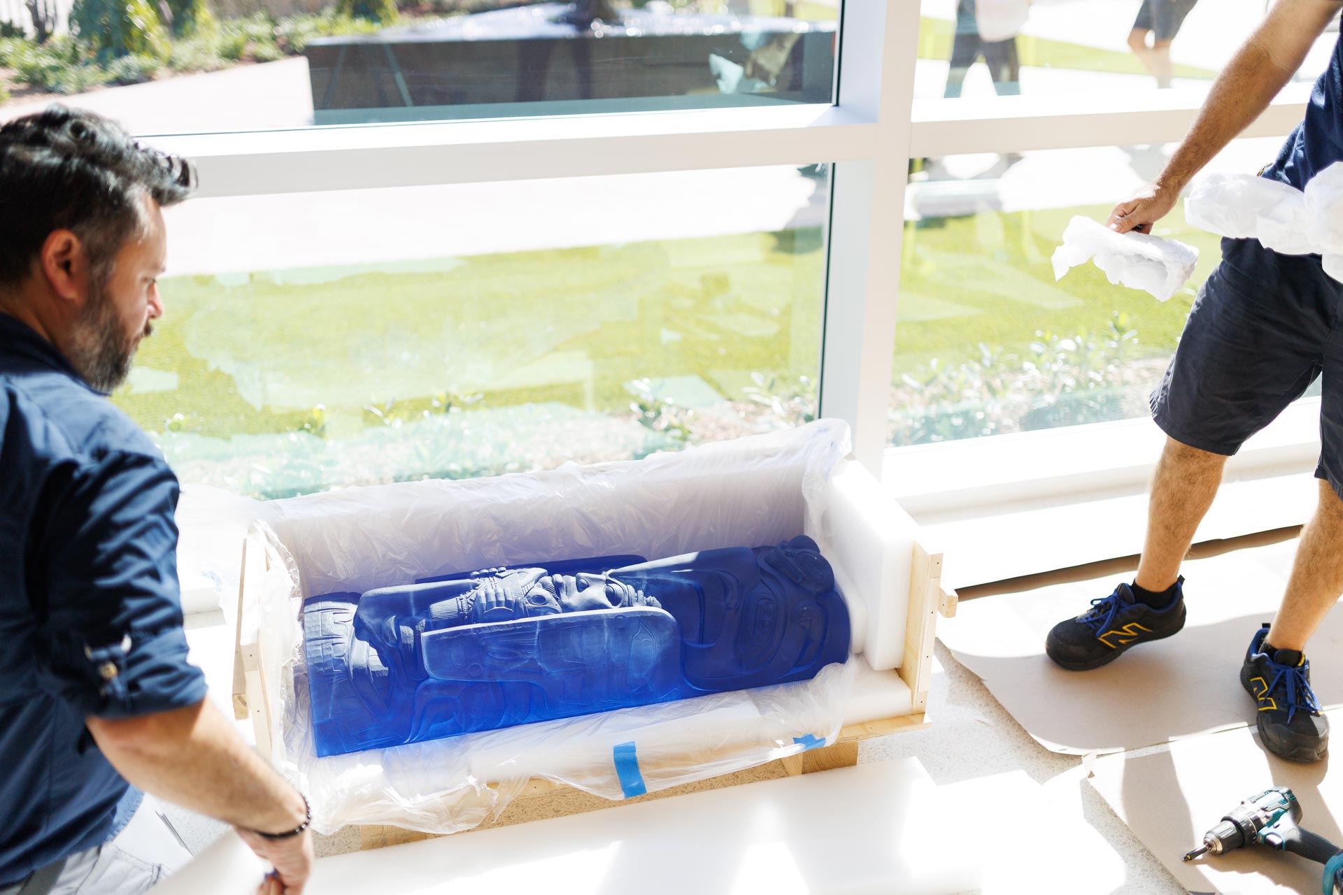 installation of cast lead crystal sculpture entitled Fog Woman by artist Preston Singletary, photo by Heather Holt