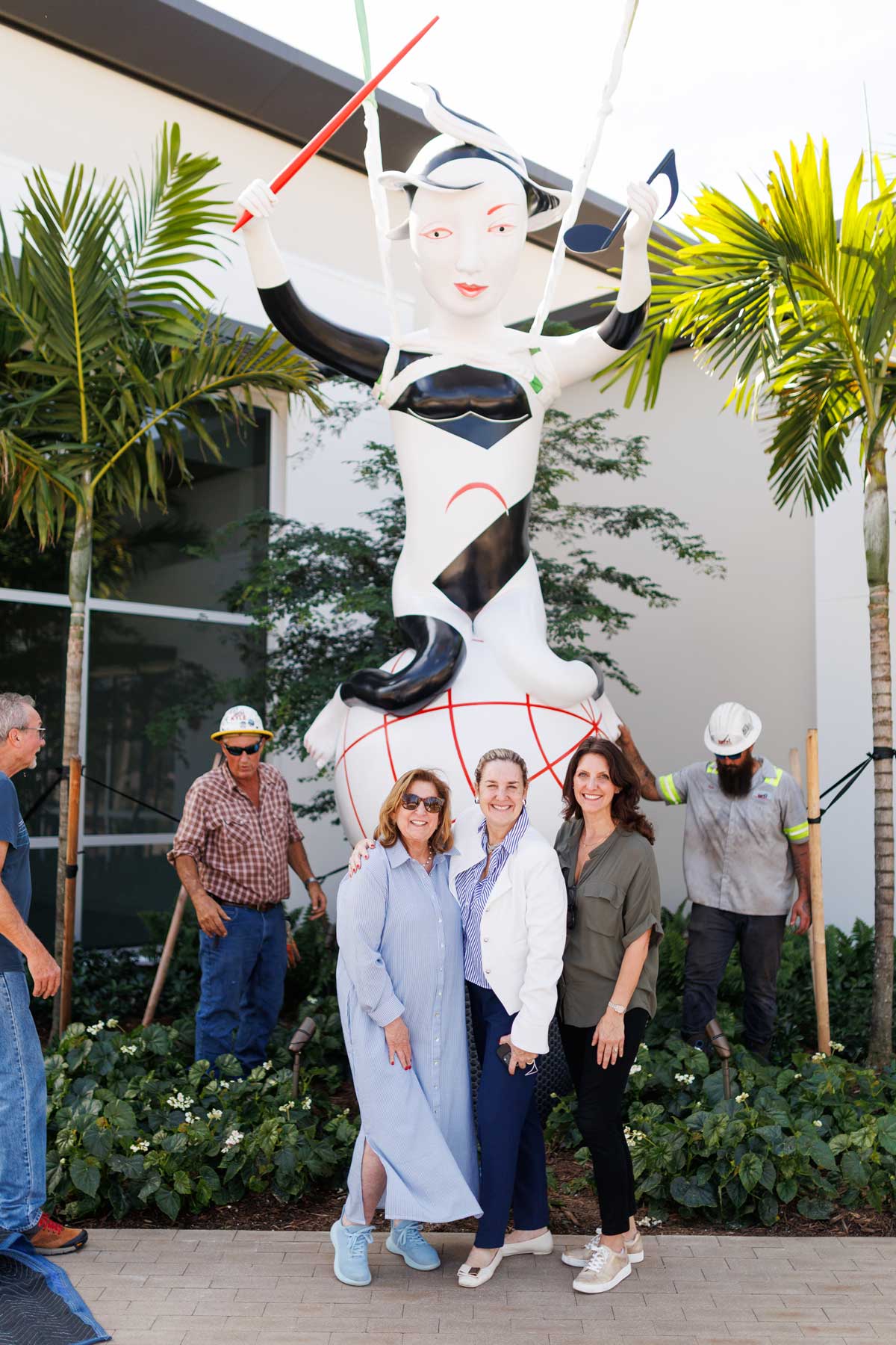 Dolores Fernando Alonso and Santra Baker of South Florida PBS with Dena Rigby in front of newly installed cast aluminum and paint sculpture entitled Harmony by artist Patti Warashina, photo by Heather Holt