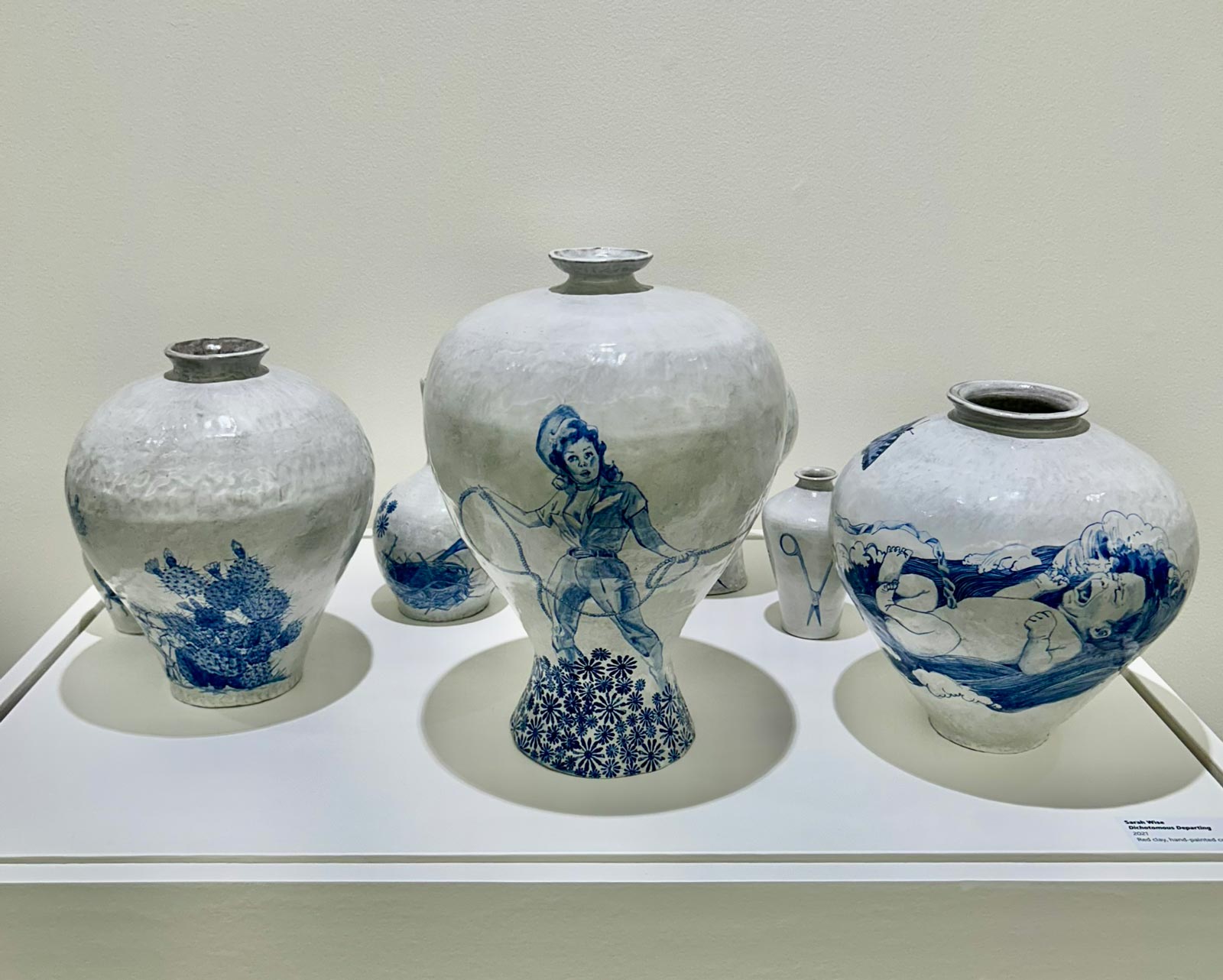 Sarah Wise clay piece titled Dichotomous Departing, made with red clay and hand-painted cobalt; photo by David Hunter Hale