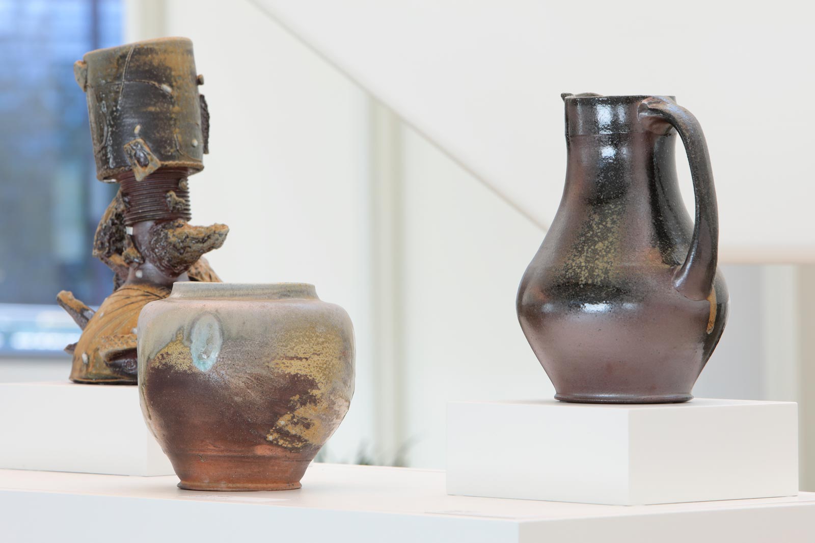 Randy Edmonson clay piece titled Vase, woodfired stoneware; Tyler Gulden clay piece titled Teapot, woodfired stoneware; Mary Maglieri clay piece titled Vase, woodfired stoneware; photo by David Hunter Hale