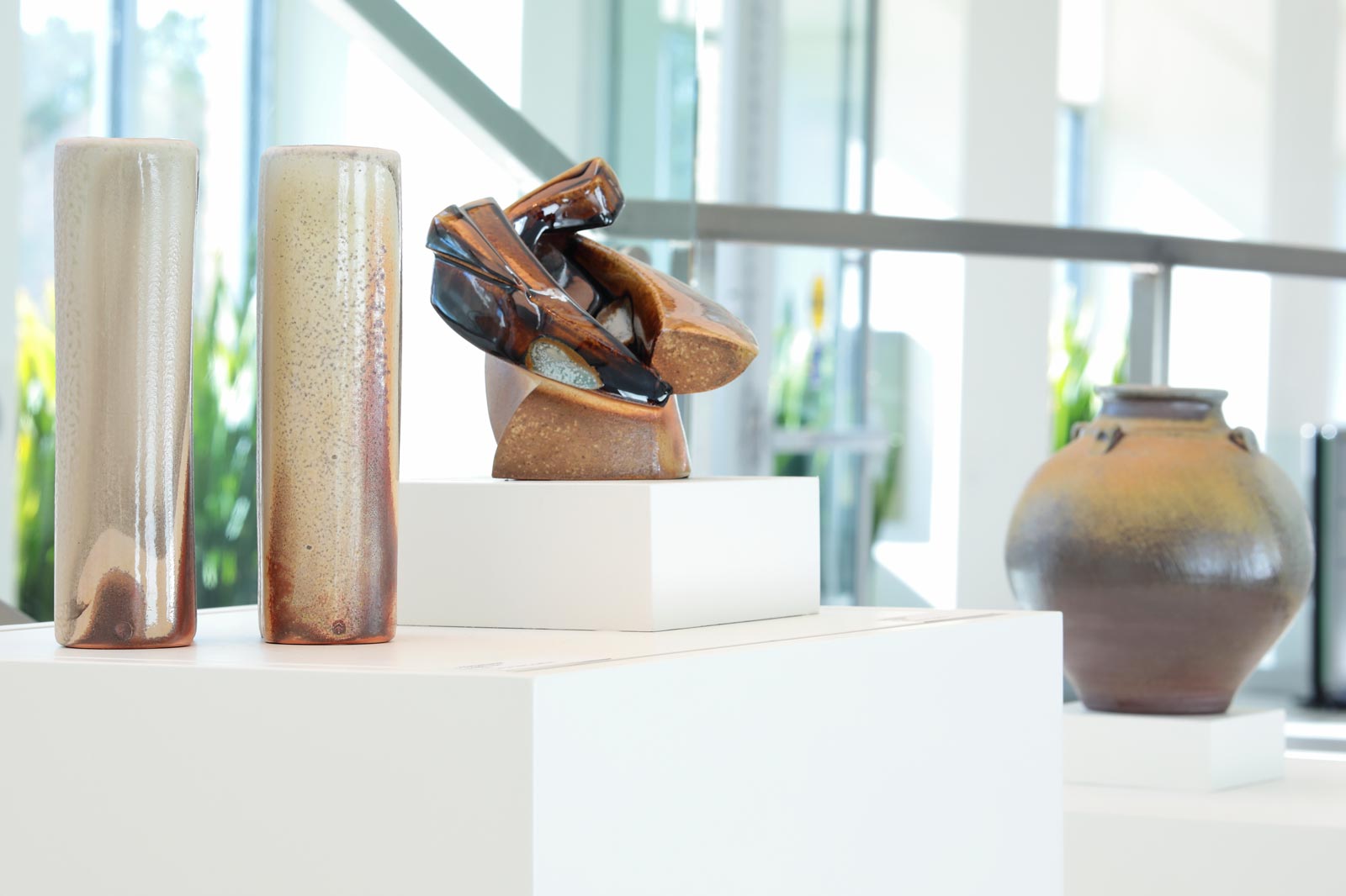 Cricket Edmonson clay pieces titled Jars, woodfired stoneware; Dan Molyneux clay piece titled Tenmoku Teabowl, woodfired stoneware; photo by David Hunter Hale