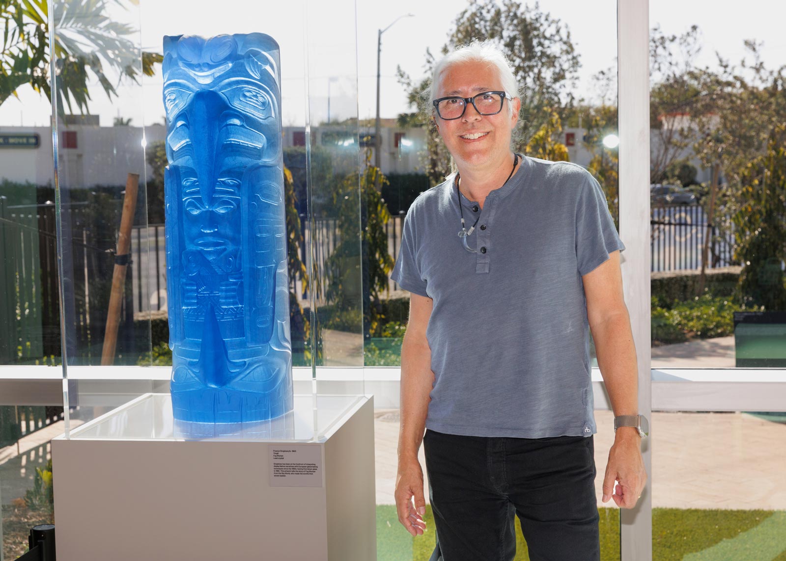 artist Preston Singletary with his cast lead crystal sculpture entitled Fog Woman, photo by Heather Holt