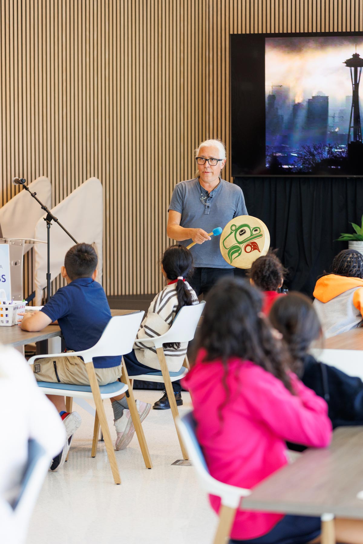 Preston Singletary, artist, presents Tlingit arts and culture to local students on a field trip, photo by Heather Holt